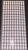 Uneekor eye mini club tracking dots on a backing sheet. 