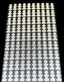 A set of white puzzle piece dots designed for use with golf launch monitors, arranged in rows.
