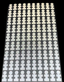 A set of white puzzle piece dots designed for use with golf launch monitors, arranged in rows on a black background.