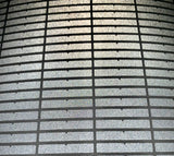 Uneekor QED club data strips on a sheet under a light. 
