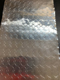 A metallic double dot patterned surface, likely used for golf radar ball sets.