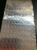 a sheet of figure eight shaped metal dots for radar based golf launch monitors